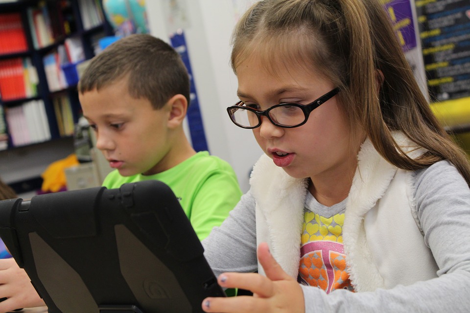 child on iPad tech free educational apps for kids